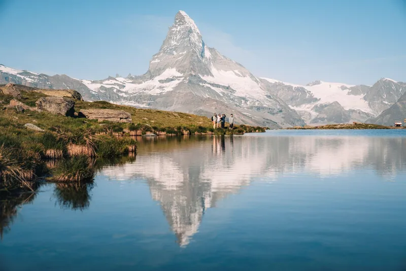 Travelers viewing the Matterhorn above Zermatt village on a Zermatt day trip from Geneva, Switzerland