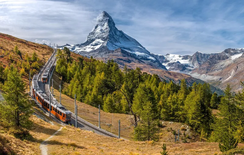 Gornergrat cogwheel train climbing toward the Matterhorn on a Zermatt tour, Switzerland